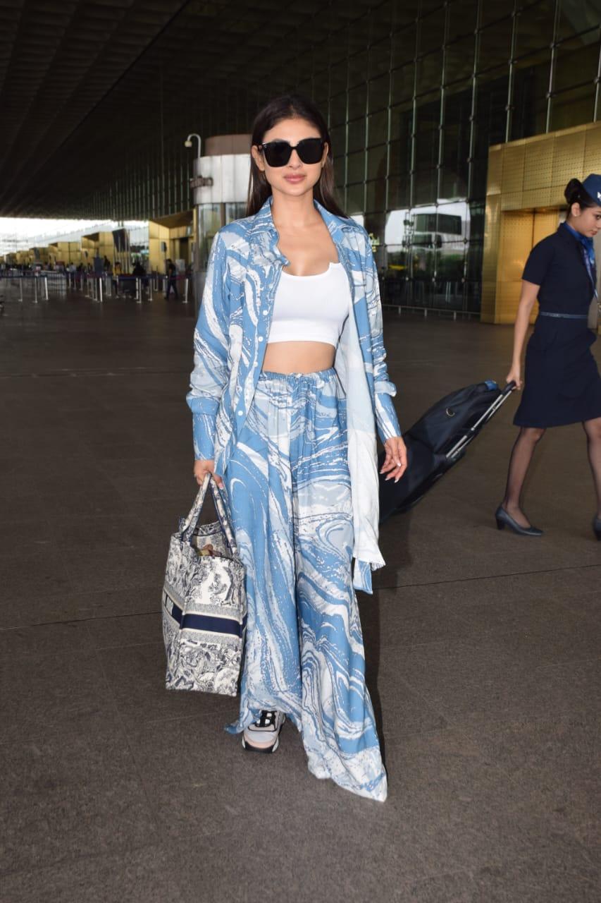 Mouni nailed airport glam in her chic look and a supporting Dior tote bag